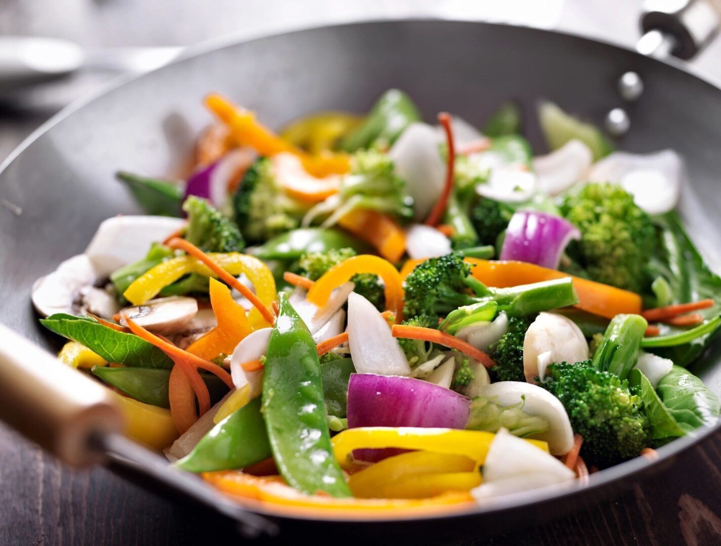 Colorful mixed vegetable stir-fry in wok